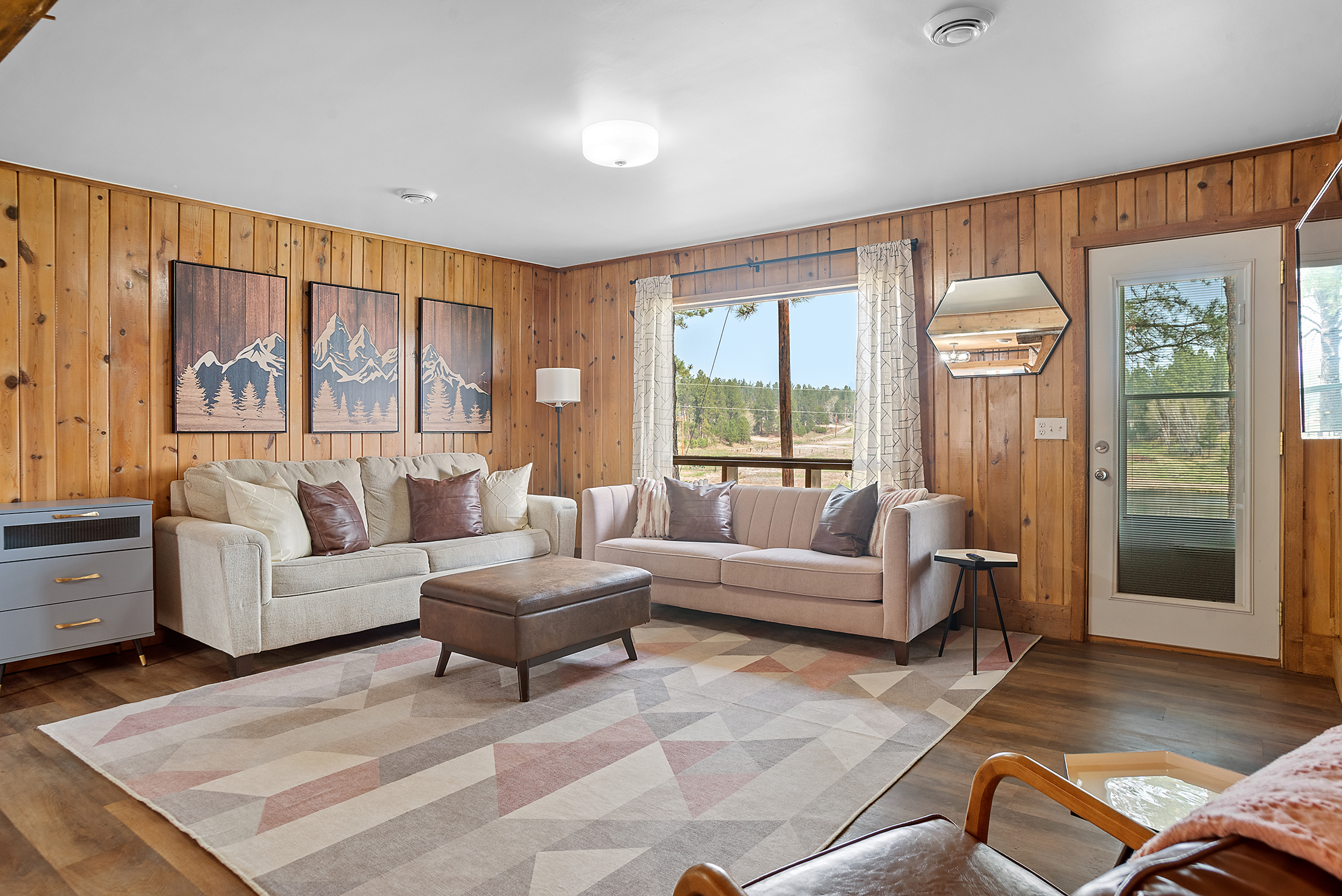 1. Welcome to our Spacious living room! With a comfy couch and modern accent chair.
