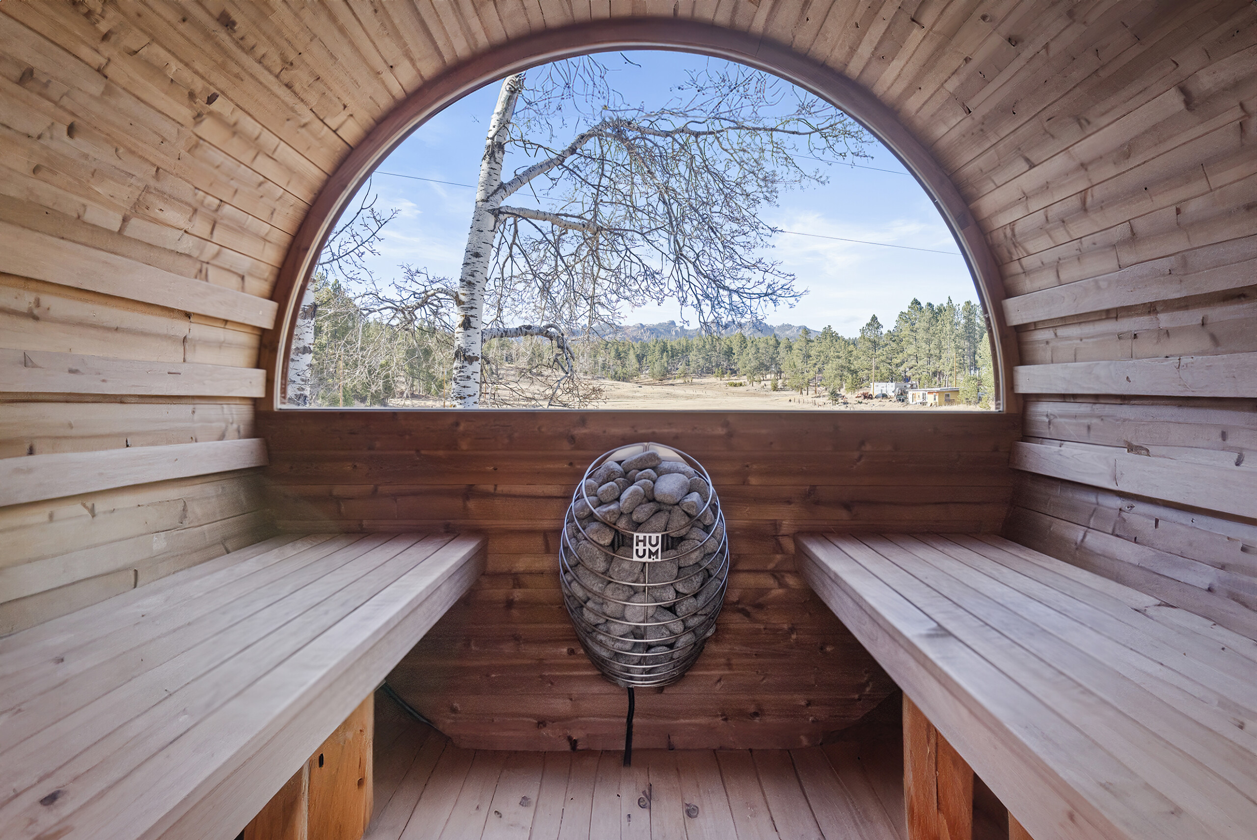 Indulge in a serene sauna session with panoramic views of Needle Spires